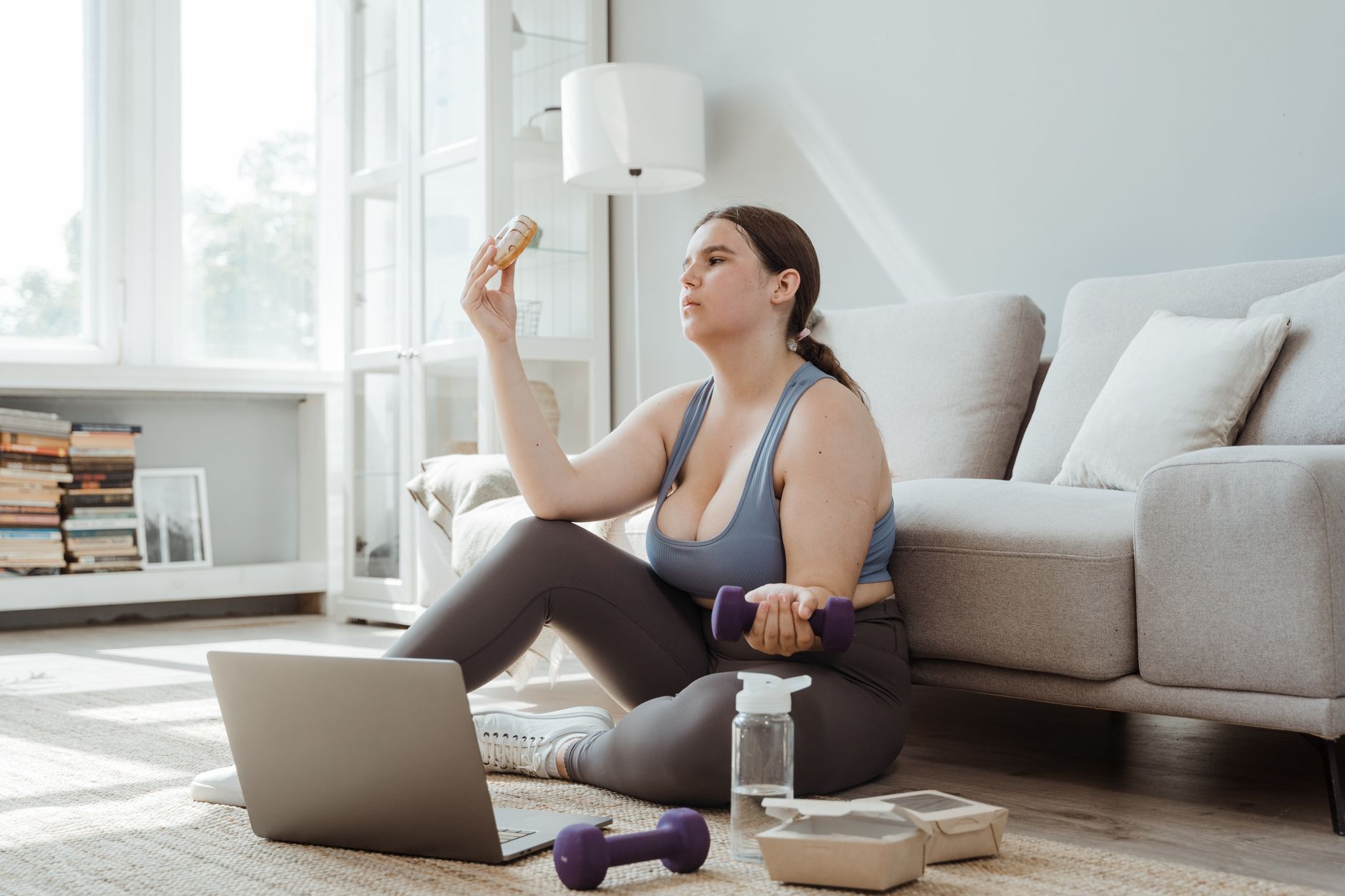 A person putting down a glass of alcohol, focusing on healthier habits.