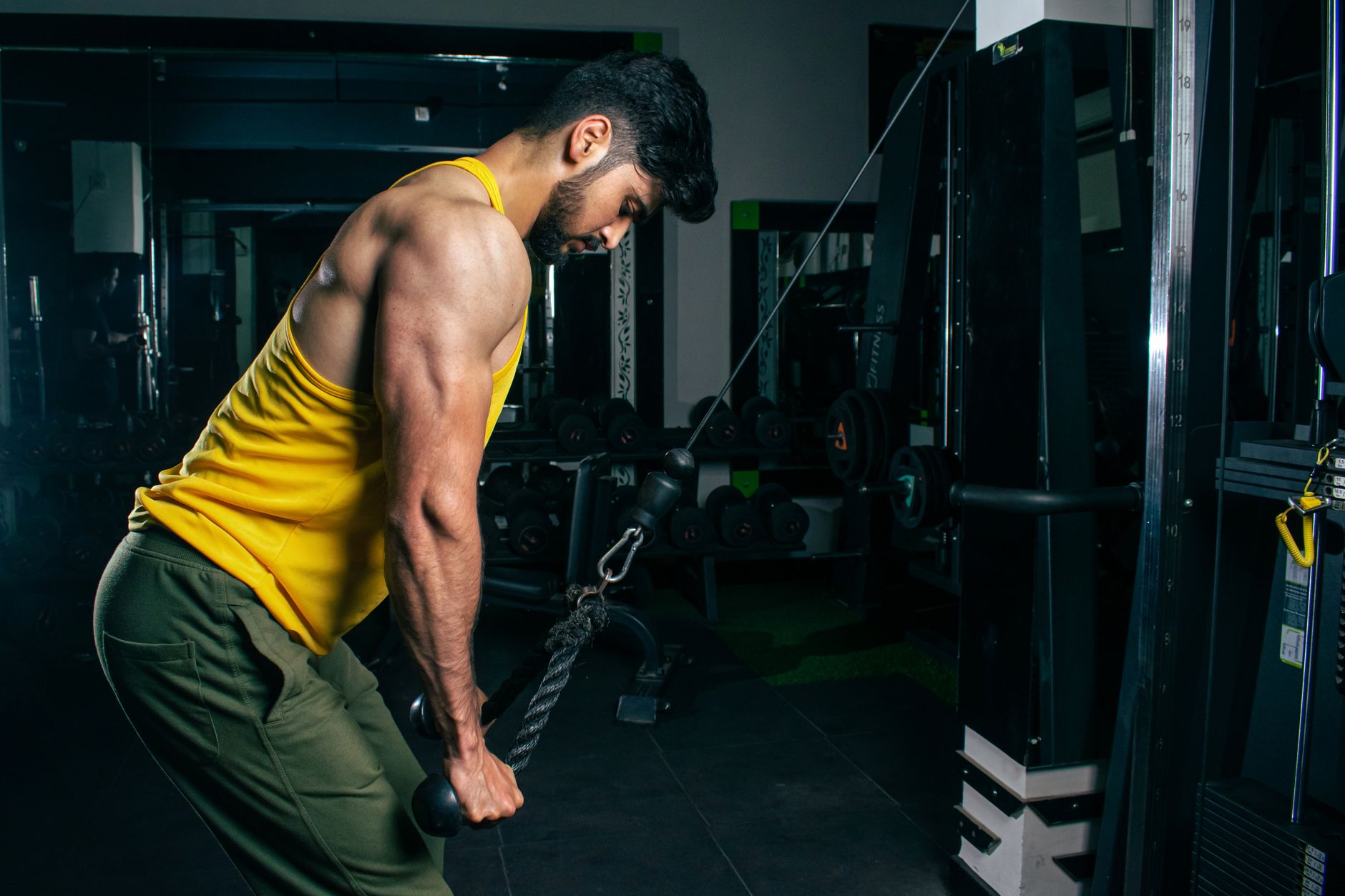 A serious lifter preparing for a heavy barbell press in a garage gym